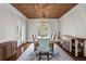 Elegant dining room with hardwood floors, wood-slatted ceiling, and stylish furnishings at 417 Lynne Cir, Alpharetta, GA 30009