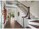 Inviting foyer with wood floors, staircase, and a view into the living spaces at 417 Lynne Cir, Alpharetta, GA 30009