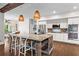 Spacious kitchen featuring a large island with seating, stainless steel appliances, and modern lighting at 417 Lynne Cir, Alpharetta, GA 30009