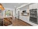 Well-equipped kitchen with stainless steel appliances, a view of dining room, and stylish accents at 417 Lynne Cir, Alpharetta, GA 30009
