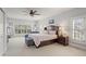 Serene main bedroom featuring natural light, neutral tones, and comfortable seating area at 417 Lynne Cir, Alpharetta, GA 30009