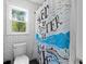 Tiled bathroom with white subway tile and a patterned shower curtain at 608 Apache Trl, Woodstock, GA 30189