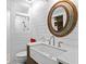 Modern bathroom featuring shiplap walls, a farmhouse sink, and glass enclosed shower at 608 Apache Trl, Woodstock, GA 30189