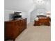 Attic bedroom with neutral carpet, large dresser, and comfortable sleeping arrangements at 608 Apache Trl, Woodstock, GA 30189