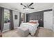 Bedroom with gray walls, carpet floors, two large windows, and decorative wall trim at 608 Apache Trl, Woodstock, GA 30189