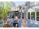 Spacious wooden deck with seating area, fire pit and access to home at 608 Apache Trl, Woodstock, GA 30189