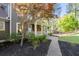 Lovely porch featuring plants and rocking chairs, enhancing the charm of the house with a meticulously landscaped yard at 608 Apache Trl, Woodstock, GA 30189