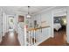 Bright hallway with decorative signs and views into the bathroom and bedroom at 608 Apache Trl, Woodstock, GA 30189