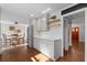 Bright kitchen with ample cabinet space, stainless refrigerator, and adjacent dining area at 608 Apache Trl, Woodstock, GA 30189