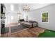 Bright living room with hardwood floors, fireplace, and entertainment area at 608 Apache Trl, Woodstock, GA 30189