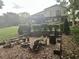 Relax by the fire pit in the backyard oasis, framed by lush greenery and a multi-level deck at 2926 Summercrest Ln, Duluth, GA 30096