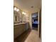 The primary bathroom features double sinks, granite countertops and easy access to the main bedroom at 2926 Summercrest Ln, Duluth, GA 30096