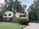Two-story home with mature trees and a well-maintained lawn offers both privacy and curb appeal at 2926 Summercrest Ln, Duluth, GA 30096