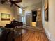 Inviting living area featuring hardwood floors, a ceiling fan, and an abundance of natural light at 2926 Summercrest Ln, Duluth, GA 30096