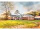 Expansive backyard with mature trees and a well-maintained lawn at 3874 Carriage Sw Ln, Conyers, GA 30094