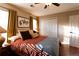 Comfortable bedroom featuring neutral walls, natural lighting, a ceiling fan, and closet at 3874 Carriage Sw Ln, Conyers, GA 30094