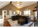 Inviting living room with vaulted ceilings, hardwood floors, and comfortable seating at 3874 Carriage Sw Ln, Conyers, GA 30094