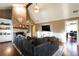 Open-concept living room with a brick fireplace, large TV, and comfortable seating at 3874 Carriage Sw Ln, Conyers, GA 30094