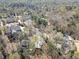 Overhead view of upscale homes nestled among mature trees and professionally landscaped yards in a desirable neighborhood at 812 Burning Tree Se Ct, Marietta, GA 30067