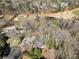 Stunning aerial view of property backing onto a golf course with mature tree coverage at 812 Burning Tree Se Ct, Marietta, GA 30067