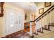 Welcoming foyer featuring a staircase, double doors, and decorative accents at 812 Burning Tree Se Ct, Marietta, GA 30067