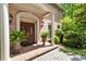 Elegant brick home entrance with ornate double doors and manicured landscaping at 812 Burning Tree Se Ct, Marietta, GA 30067