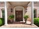 Charming front entrance featuring brickwork, pillars, and decorative double doors at 812 Burning Tree Se Ct, Marietta, GA 30067