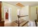 Bright hallway featuring hardwood floors, white trim, and access to multiple rooms at 812 Burning Tree Se Ct, Marietta, GA 30067