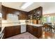 Well-maintained kitchen with dark wood cabinets, a white countertop, and classic design at 812 Burning Tree Se Ct, Marietta, GA 30067