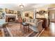 Comfortable living room featuring a fireplace, built-in shelving, and a beautiful oriental rug at 812 Burning Tree Se Ct, Marietta, GA 30067
