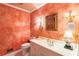 Charming powder room with stylish fixtures, decorative accents, and a unique painted wall finish at 812 Burning Tree Se Ct, Marietta, GA 30067