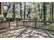 Relaxing outdoor wooden deck surrounded by green foliage at 3427 Springlake Dr, Decatur, GA 30032