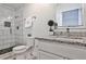 Stylish bathroom with white tile shower and granite-topped vanity at 3427 Springlake Dr, Decatur, GA 30032
