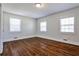 Bright bedroom with hardwood floors and ample natural light from three windows at 3427 Springlake Dr, Decatur, GA 30032