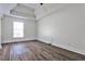 Bright bedroom with stylish tray ceiling, and wood-look flooring at 3427 Springlake Dr, Decatur, GA 30032