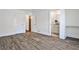 Bright bedroom features wood-look flooring and white trim, with ensuite bathroom access at 3427 Springlake Dr, Decatur, GA 30032