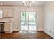 Bright dining space showcasing hardwood floors and a sliding door exit to the back porch at 3427 Springlake Dr, Decatur, GA 30032