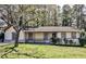 Charming ranch-style home with a welcoming front porch and a well-maintained lawn at 3427 Springlake Dr, Decatur, GA 30032