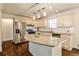 Bright eat-in kitchen features an island, stainless steel appliances, and white subway tile backsplash at 3427 Springlake Dr, Decatur, GA 30032