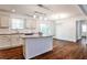 Beautiful kitchen with granite counters and island flowing to the dining room with a patio exit at 3427 Springlake Dr, Decatur, GA 30032
