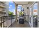 Private outdoor balcony with black railings and views of the surrounding building at 799 Hammond Dr # 205, Sandy Springs, GA 30328