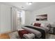 Bedroom featuring a large window, natural light, and neutral decor at 799 Hammond Dr # 205, Sandy Springs, GA 30328