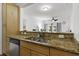 Kitchen boasts granite countertops, stainless steel appliances, and a view of a naturally lit seating area at 799 Hammond Dr # 205, Sandy Springs, GA 30328