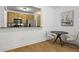 Kitchen with a view of the dining area, featuring modern appliances and a practical breakfast bar at 799 Hammond Dr # 205, Sandy Springs, GA 30328
