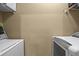 Bright laundry room featuring modern, front-loading washer and dryer at 799 Hammond Dr # 205, Sandy Springs, GA 30328