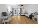 Comfortable living room offers hardwood floors, natural light from balcony, ceiling fan, and relaxing seating at 799 Hammond Dr # 205, Sandy Springs, GA 30328