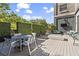 Stylish rooftop deck boasts outdoor seating, a modern fire pit, and a serene ambiance at 799 Hammond Dr # 205, Sandy Springs, GA 30328