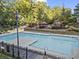 Inviting swimming pool surrounded by lounge chairs and lush landscaping at 799 Hammond Dr # 205, Sandy Springs, GA 30328