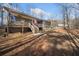 Expansive backyard with deck, stairs, and mature trees offering plenty of space at 138 Rutledge Rd, Temple, GA 30179