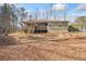 Generous backyard with a large deck, mature trees, and ample open space at 138 Rutledge Rd, Temple, GA 30179